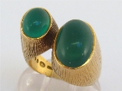 A 1960s 18 carat gold and green stone ring by