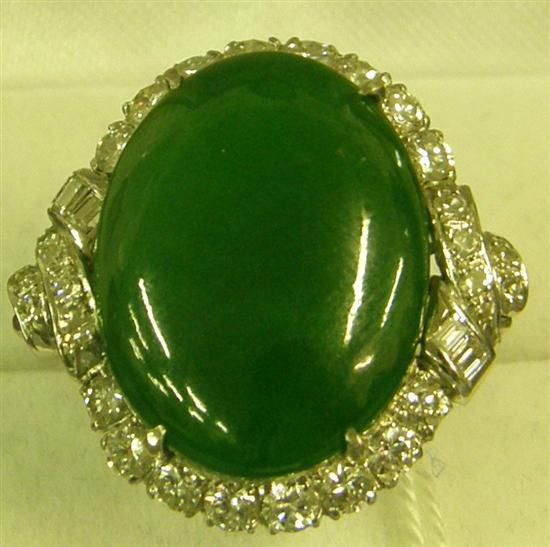 A DIAMOND AND JADE SET RING