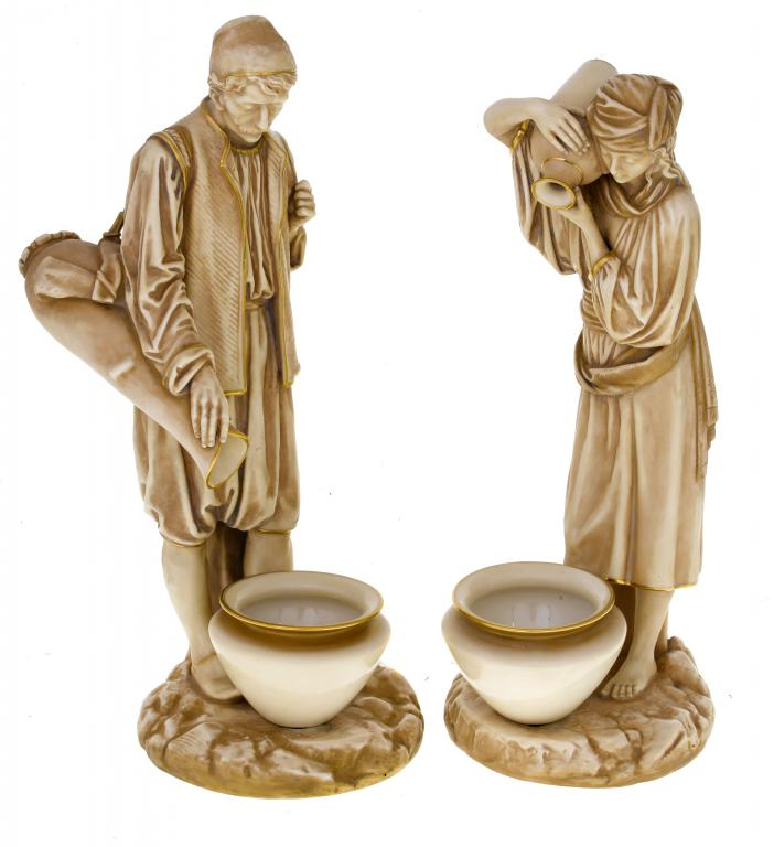 A PAIR OF ROYAL WORCESTER FIGURES OF EASTERN WATER CARRIERS