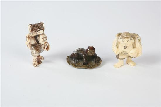 THREE NETSUKES Japanese 20th century Two ivory figures Ebisu and