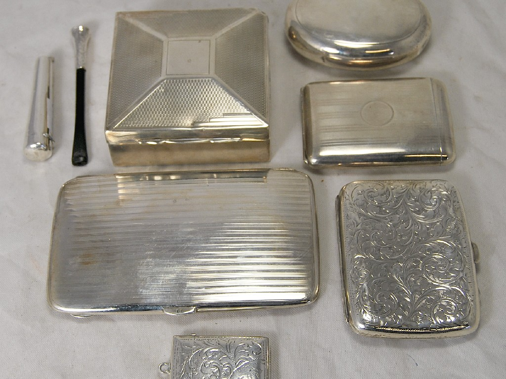 Collection of silver smoking requisites including cigarette box three cigarette