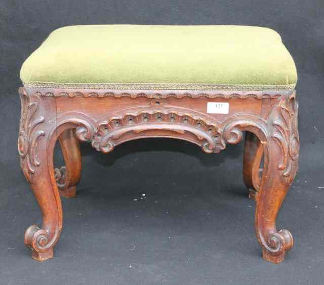 A VICTORIAN WALNUT STOOL of rectangular form on cabriole supports