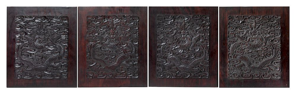 A Set of Four Chinese Zitan Wood Dragon Panels Each