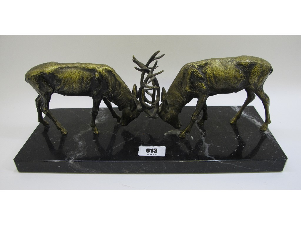 Pair of Spelter fighting deers on black marble base