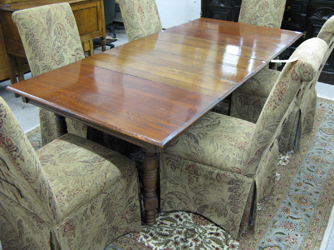A VICTORIAN SQUARE OAK DINING TABLE WITH EIGHT LEAVES Eastlake