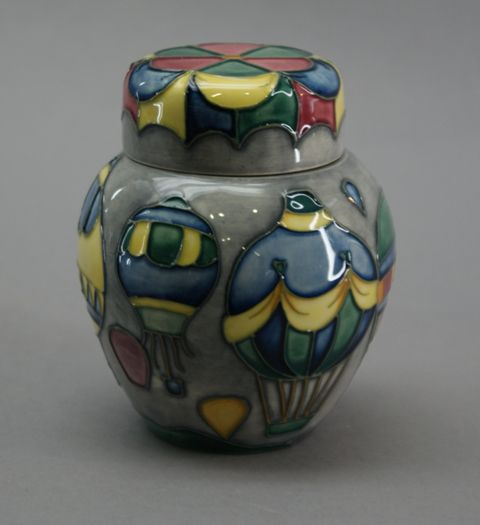 A ginger jar decorated in a air balloon design Impressed