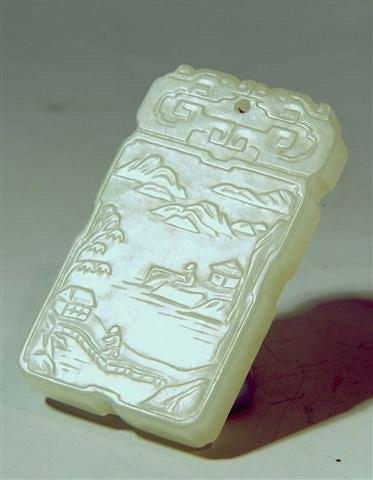 AN ANTIQUE CHINESE JADE PENDANT of rectangular form one side