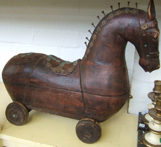 An early 20th century hardwood model of a horse on