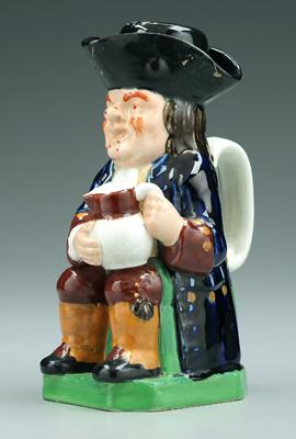 Copeland Toby jug with measure seated with dark blue coat