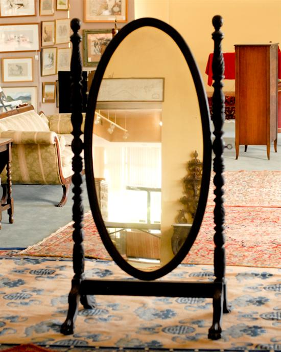 A Centennial Mahogany Cheval Mirror with and old alligatored finish
