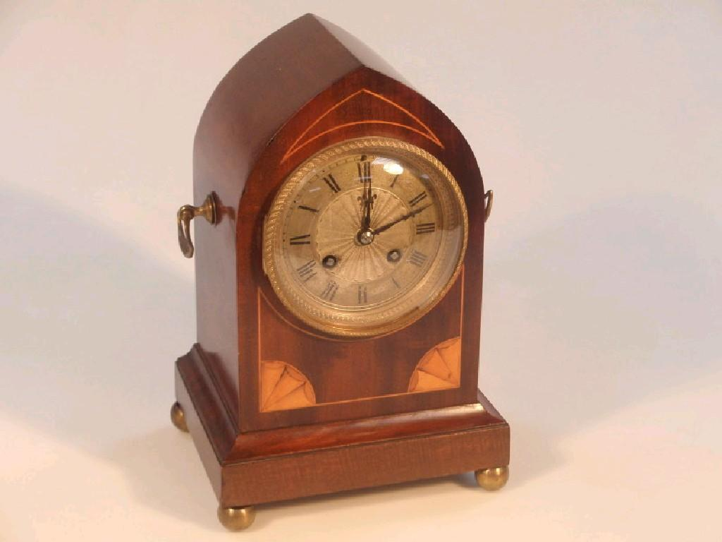An early 20thC mahogany cased mantel clock with a French