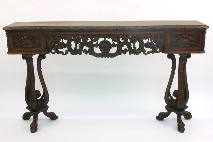 HIGHLY CARVED MAHOGANY AND WALNUT CONSOLE TABLE American c 1920