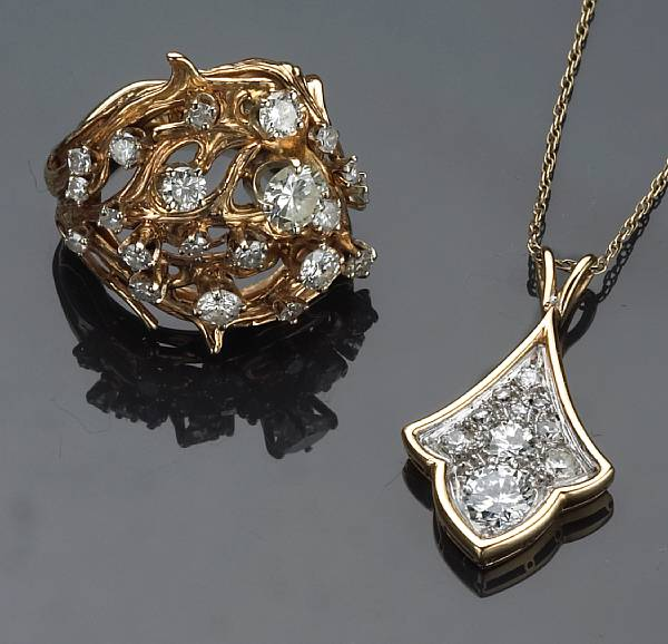 A diamond and 14k gold ring and pendant with chain