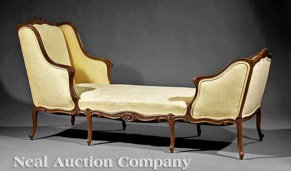 A Louis XV Style Carved Walnut Duchesse carved crest serpentine