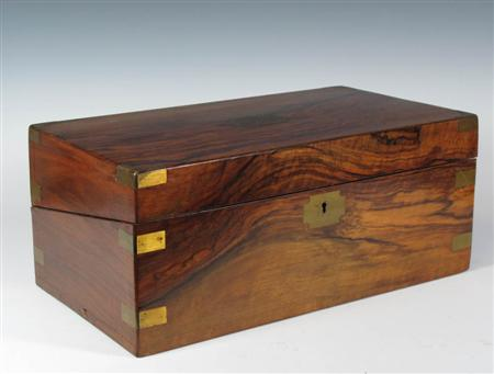 A late Victorian rosewood and brass bound lap desk of