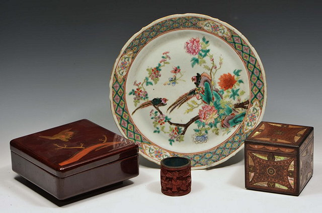 A JAPANESE RED LACQUER KOBI containing counters a small cinnabar
