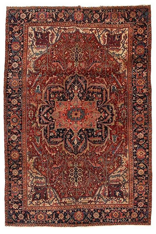 Heriz Rug central salmon and navy blue medallion red field