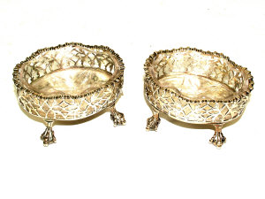 A pair of George III silver salts of pierced oval