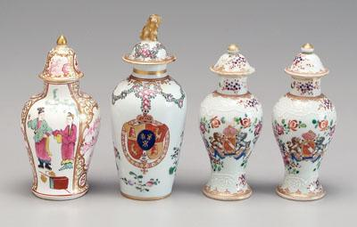Four porcelain tea caddies one conical gilt Buddhist lion finial