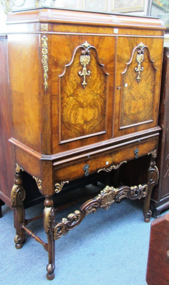 An early 18th century Portuguese style parcel gilt walnut framed