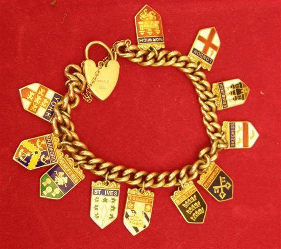 Gold curb link bracelet with padlock clasp and eleven enamelled