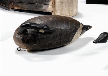 Carved and painted sleeping canada goose decoy early 20th century