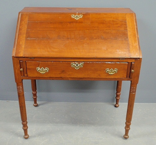 Sheraton cherry slant lid desk c 1830 with a pigeonholed