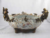 A ceramic continental centrepiece pierced oval bowl with hand painted