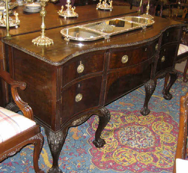 ENGLISH CHIPPENDALE STYLE MAHOGANY SIDEBOARD Shaped top with foliate carved