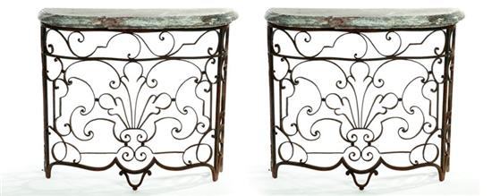 PAIR OF CONSOLE TABLES Twentieth century wrought iron and marble