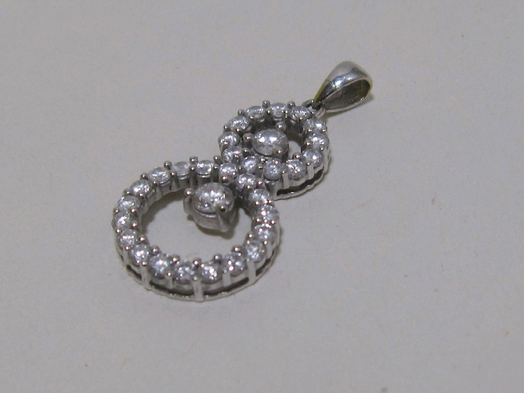 Eighteen carat white gold diamond set pendant in the form