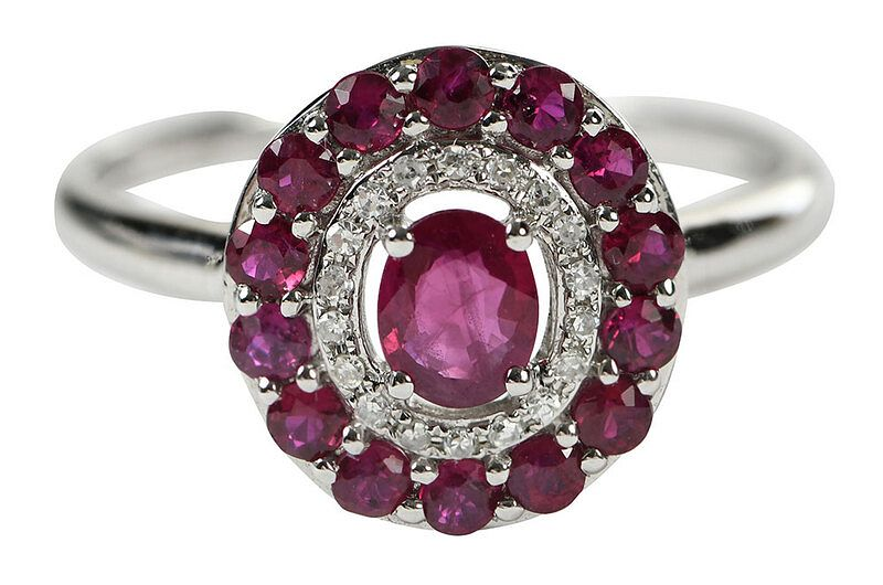 14kt Ruby and Diamond Ring center oval faceted ruby approx