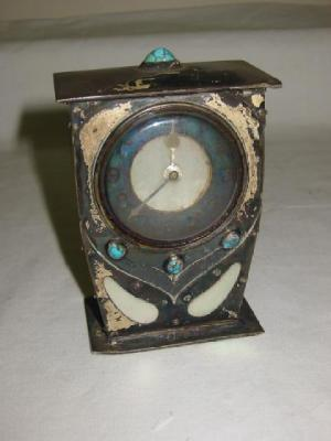AN ARTS AND CRAFTS MANTEL CLOCK the French movement having