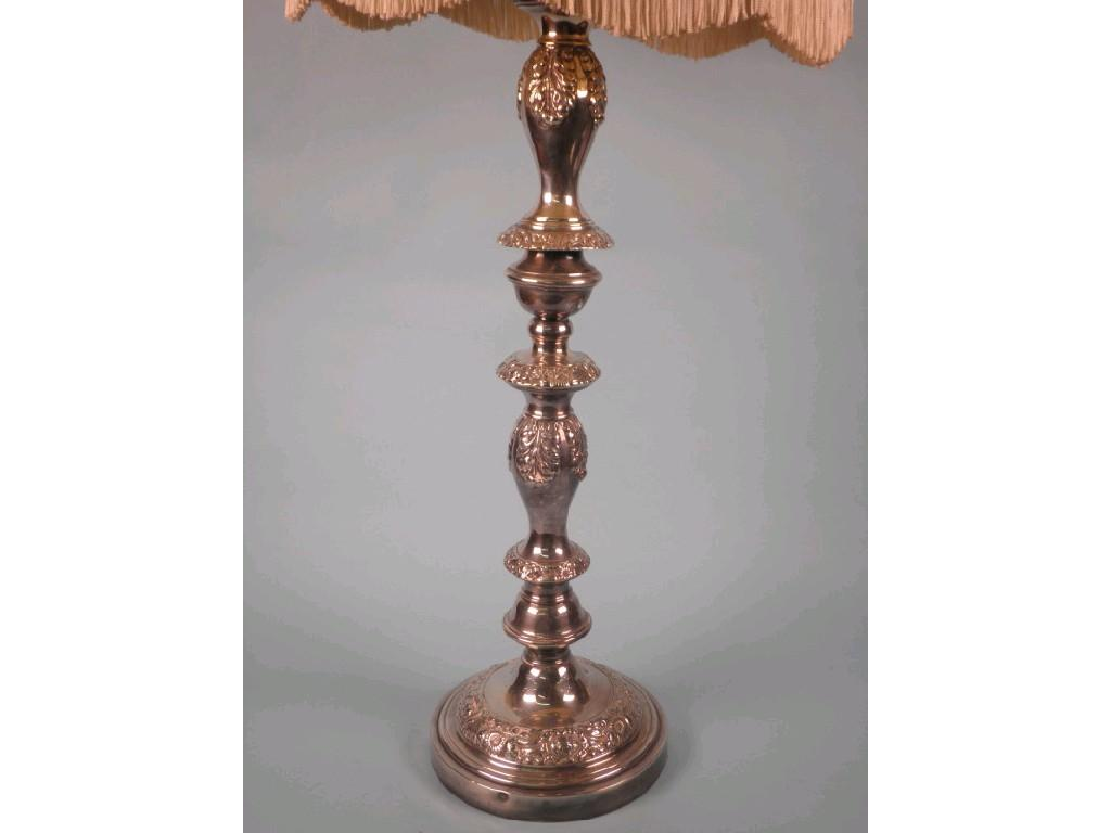 A silver plated table lamp cast with leaves and scrolls