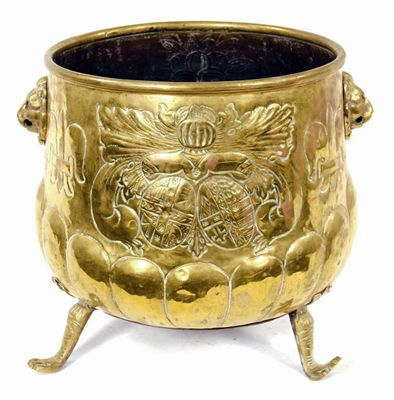 A Dutch brass jardiniere with embossed decoration and lion s