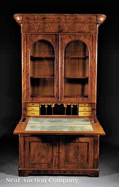 An American Late Classical Carved Mahogany Desk and Bookcase c