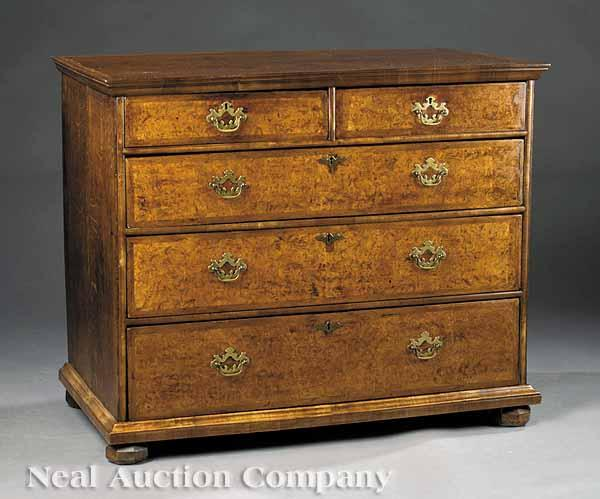 A George I Burled and Inlaid Walnut Chest of Drawers