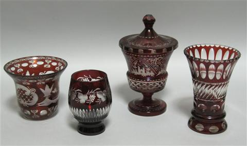 FOUR PIECES OF BOHEMIAN GLASS Comprising a covered flaring jar