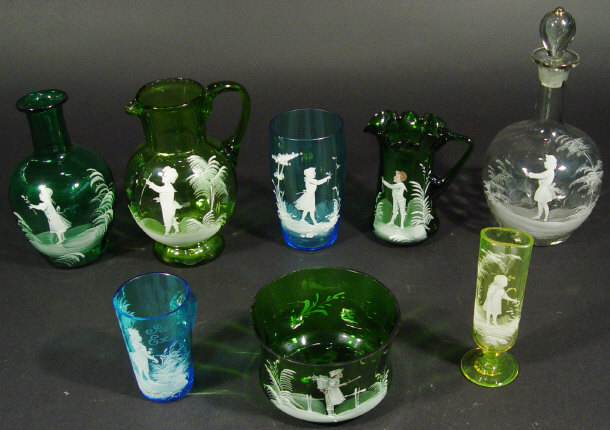 Seven Mary Gregory glass items each enamelled in white with