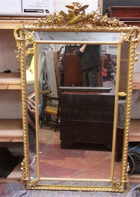A large 19th century giltwood framed overmantel mirror the rectangular