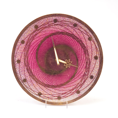 Sunbeam atomic clock with circular pink and gold glass face