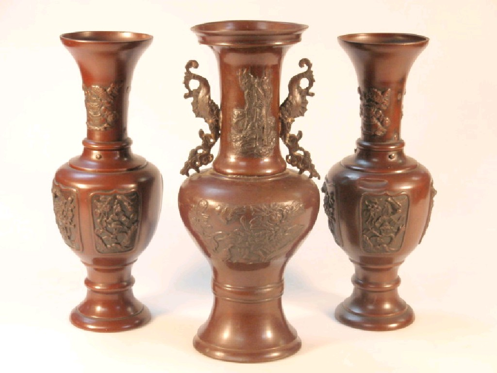 A pair of Japanese bronzed metal urn shaped vases with