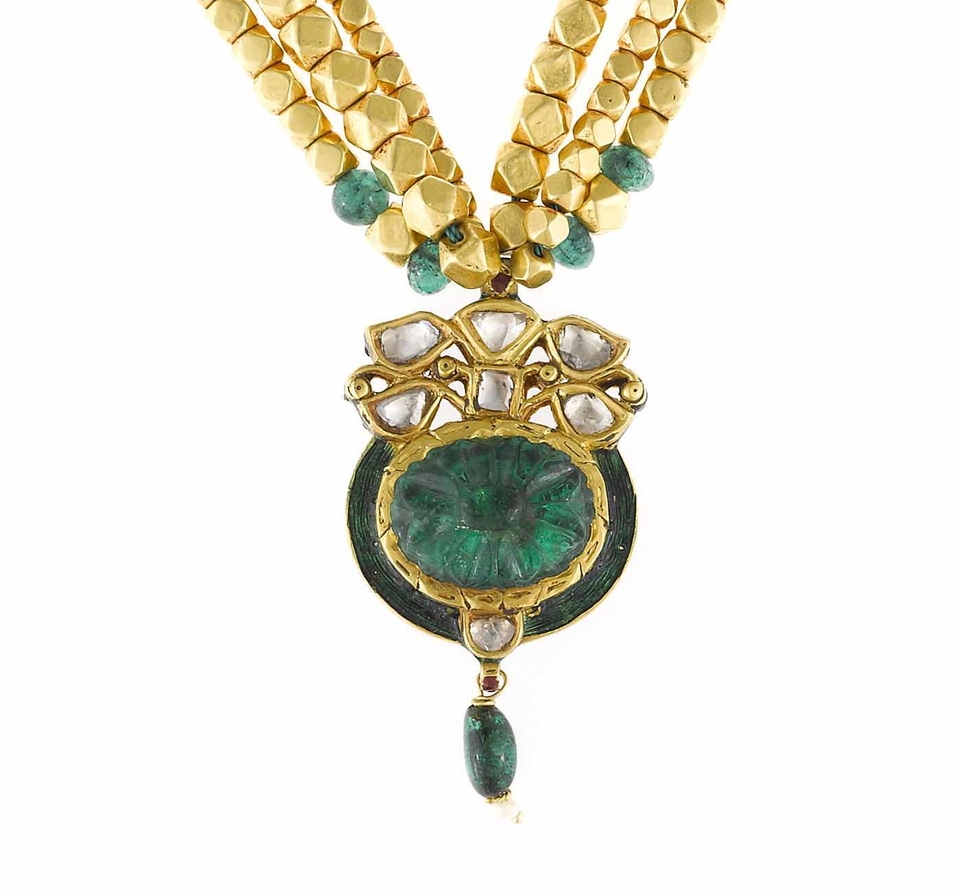 An emerald diamond enamel and seed pearl three strand pendant