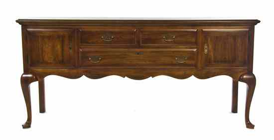 A Queen Anne Style Mahogany Sideboard having a rectangular top