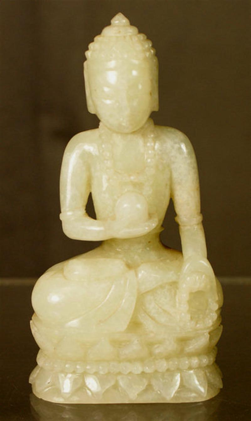 Carved light green jadeite seated Buddha 5 h Estimate 200