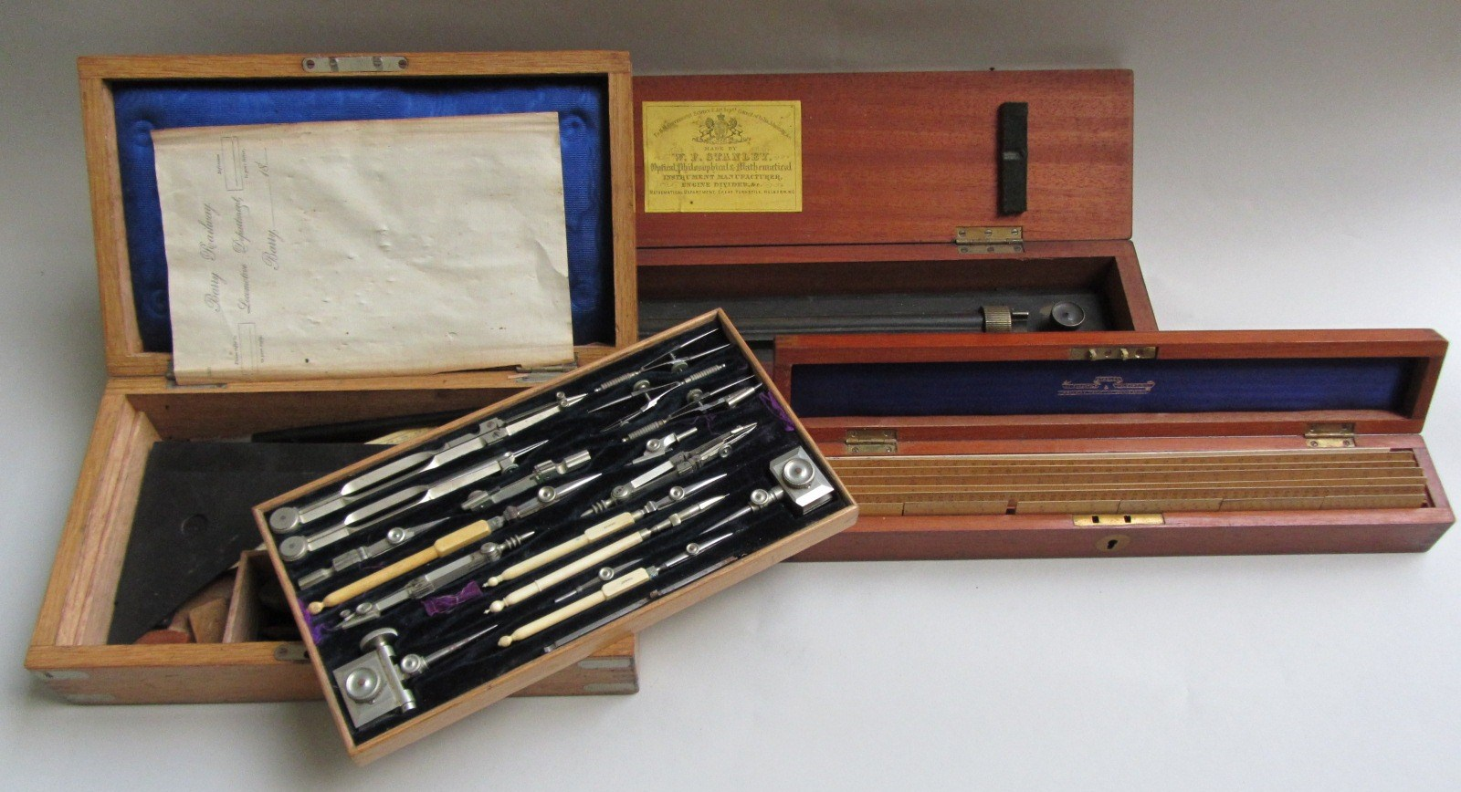 A Stanley oak cased drawing instruments set early 20th century