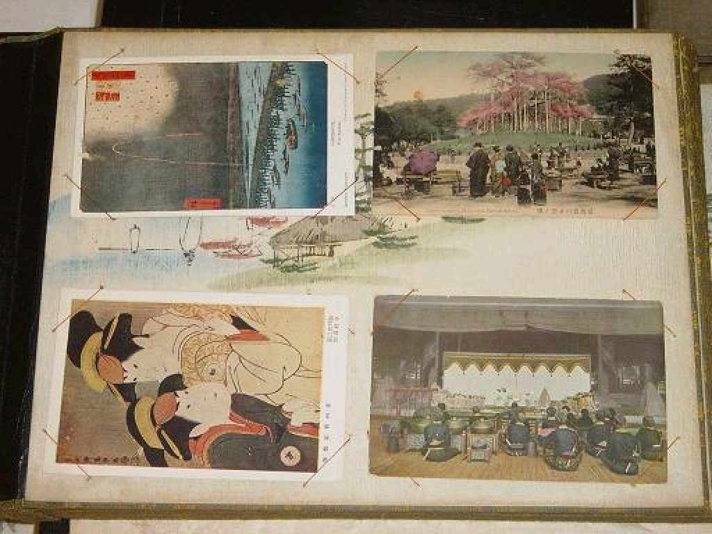 A Japanese black lacquered album with dragon decoration containing a