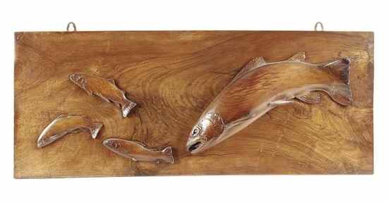 A carved and stained walnut and beech wall panel modelled