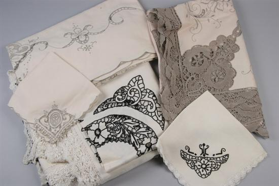 THREE ECRU LINEN CUT WORK AND EMBROIDERED TABLECLOTHS One black