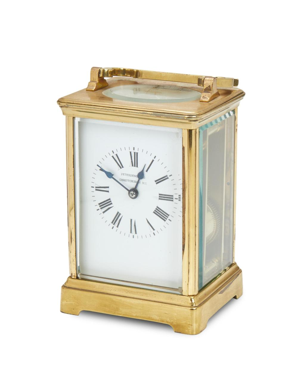 A French brass carriage clock with fitted leather travel case